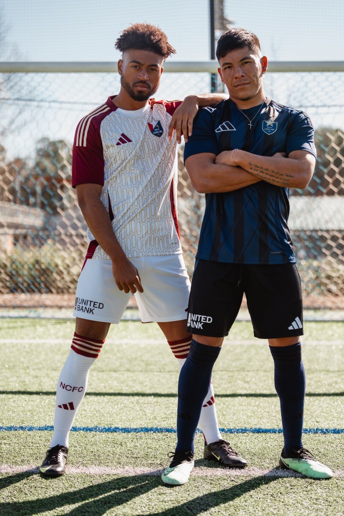 North Carolina FC players Shaft Brewer Jr. and Mikey Maldonado show off the team's new home and away kits, which feature United Bank's logo on the right leg of the shorts.